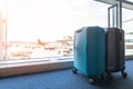 Travel luggage suitcase at the airport terminal in waiting area for departure flight for business transportation and vacation Royalty Free Stock Photo