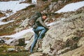 Travel Man with backpack climbing mountains