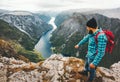 Travel Man with backpack standing on mountain top Royalty Free Stock Photo