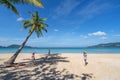 Travel man photography take a photo palm trees on the beach,Beautiful tropical sea at Patong beach Phuket thailand,New normal