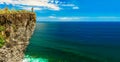 Travel man standing on the top mountain cliff on background nature landscape