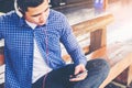 Travel man using mobile phone at train station Royalty Free Stock Photo