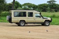 Jeep safari in a national reserve in Tanzania. Adventure by car through wild places in africa.