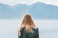 Travel in Norway globetrotter woman with backpack looking at mountains view