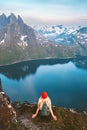 Travel in Norway tourist woman enjoying view hiking in mountains outdoor with backpack healthy lifestyle Royalty Free Stock Photo