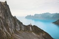 Travel Norway vacations man standing alone on cliff