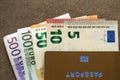 Travel passport and money, Euro banknotes bills on copy space background, top view. Traveling and  finance problems concept Royalty Free Stock Photo