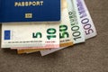 Travel passport and money, Euro banknotes bills on copy space background, top view. Traveling and  finance problems concept Royalty Free Stock Photo