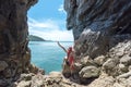 Travel people lifestyle women tourist standing and relax in summertime and vacations in a cave near the sea in Keo Sichang, Thaila Royalty Free Stock Photo