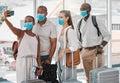 Travel people taking selfie with covid face mask at the airport on their trip, travel or holiday overseas. Group of Royalty Free Stock Photo