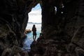 Travel people women tourist in a cave near the sea in Keo Sichang, Thailand.