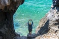 Travel people women tourist take a photo in a cave near the sea in Keo Sichang,