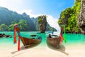 Travel photo of James Bond island with thai traditional wooden longtail boat and beautiful sand beach in Phang Nga bay Thailand