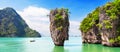 Travel photo of James Bond island with thai traditional wooden longtail boat in Phang Nga bay, Thailand Royalty Free Stock Photo