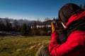 Travel photographer with camera shooting Carpathian mountain landscape scenic photography Royalty Free Stock Photo