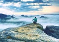 Travel photographer man taking nature video of mountain lookout.