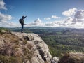 Travel photographer on mountain summit works. Man like