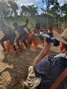 Travel photographer photographing an Aboriginal Australians ceremonial dance in Cape York Queensland Australia
