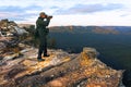 Travel photographer photographing the landscape from  Lincoln Rock Lookout at sunrise of the Grose Valley located within the Blue Royalty Free Stock Photo