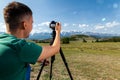 Travel photographer taking nature photo Royalty Free Stock Photo