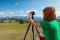 Travel photographer taking nature photo Royalty Free Stock Photo