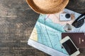 Travel plan, trip vacation accessories for trip, tourism mockup - Outfit of traveler on wooden background. Flat lay and copyspace Royalty Free Stock Photo