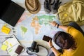 Travel planning concept with map. Overhead view of equipment for travelers. Travel concept background, Young woman pointing to the