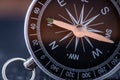 Travel planning navigation concept. Classic black magnetic detail of compass on light blue backround.