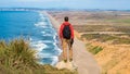 Travel in Point Reyes National Seashore, man Hiker with backpack enjoying view, California, USA