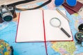 Travel preparation : compass, money, passport, road map ,sunglasses,magnifying glass ,camera ,cloth ,book on wooden table . Royalty Free Stock Photo