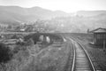 Travel, rest. A view of the railway tracks going into the distance. Black and white image. Horizontal frame Royalty Free Stock Photo