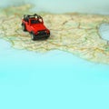 Travel on the road with map. Car travel and road trip. Concept of journey and rent a car. Selective focus, copy space. Royalty Free Stock Photo