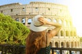 Travel in Rome. Back view of beautiful girl visiting Colosseum landmark at sunset. Summer holidays in Italy Royalty Free Stock Photo