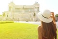 Travel in Rome. Back view of beautiful girl visiting Venice square famous landmark of Rome. Summer holidays in Italy Royalty Free Stock Photo