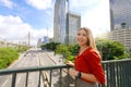 Travel in Sao Paulo, Brazil. Portrait of beautiful smiling girl with Sao Paulo cityscape and Ponte Estaiada bridge on the Royalty Free Stock Photo