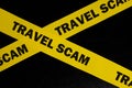 Travel scam alert, caution and warning concept. Yellow barricade tape with word in dark black background. Royalty Free Stock Photo