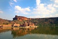 Travel shot of acient Badami temple in lake