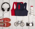 Travel and sport concept - bicycle model, shoes, shirts, headph
