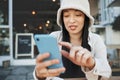 Travel, student and woman with phone at a cafe for social media, texting or chatting in a city. Smartphone, app and lady Royalty Free Stock Photo