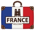 Travel suitcase with french flag and Notre Dame