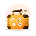 Travel suitcase vector cartoon illsutration. Yellow luggage bag with stickers for summer voyage.