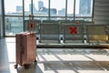 Travel suitcase at waiting chairs of airport terminal Royalty Free Stock Photo