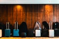 Travel suitcases lined up in a spacious hotel room of Asian tourists, with copy space Royalty Free Stock Photo