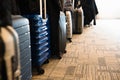 Travel suitcases lined up in a spacious hotel room of Asian tourists, with copy space Royalty Free Stock Photo