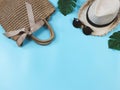 Travel and summer holiday concept, Women`s vacation accessories items woven bag,hat and sunglasseson blue background with Royalty Free Stock Photo