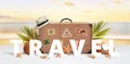 Travel text front of retro suitcase with travel stickers on beach surrounded by palm leaves, coconuts and shells Royalty Free Stock Photo