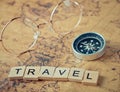 Travel text with vintage compass and glasses Royalty Free Stock Photo