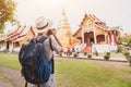 Travel to Asia, tourist photographer taking photo of temple