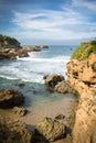 Travel to beautiful scenic colorful view on atlantic turquoise ocean with waves, coastline rocks in blue sky Royalty Free Stock Photo