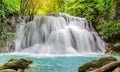 Travel to the beautiful waterfall in tropical rain forest, soft water of the stream in the natural park at Huai Mae Khamin Royalty Free Stock Photo